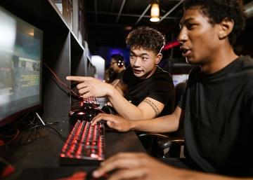 Teenage boys work on computers